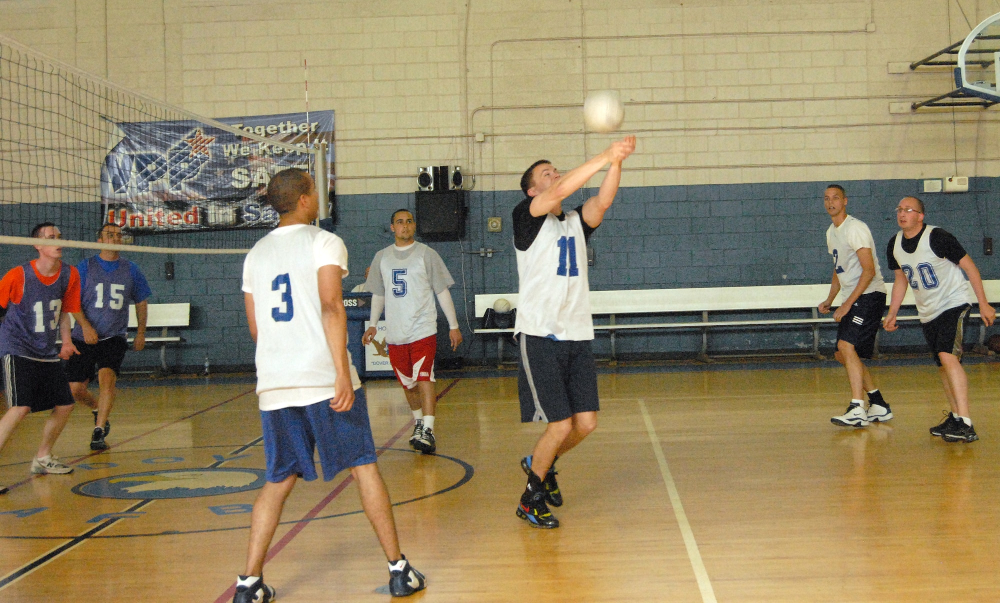 Patrick McMahon, 436th Communications Squadron, bumps the ball during a volleyball match May 18 at the Fitness Center. The CS team has 11 wins and four losses after playing the 436th Maintenance Operations Squadron. (U.S. Air Force photo/ Airman 1st Class Shen-Chia Chu) 