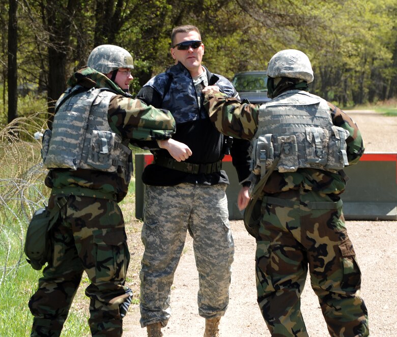 VOLK FIELD, Wisc. -- Airmen from the 375th and 133rd Airlift Wing Security Forces Squadrons challenge a mock intruder during an operational readiness exercise at Volk Field, Wisc., May 16. Airmen from active duty, Air National Guard and Reserve forces teamed up to participate in the week-long training exercise in preparation for their operational readiness inspection in March 2010.  (U.S. Air Force photo/Airman 1st Class Wesley Farnsworth)