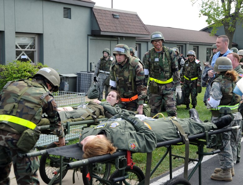 VOLK FIELD, Wisc. – Airmen from the 375th and 133rd Medical Groups help transport simulated patients to an awaiting aeromedical evacuation aircraft during an exercise at Volk Field, Wisc., May 16. Airmen from active duty, Air National Guard and the Reserve were at Volk Field to participate in a week-long training exercise in preparation for their Operational Readiness Inspection in March 2010.  (U.S. Air Force photo/Airman 1st Class Wesley Farnsworth)