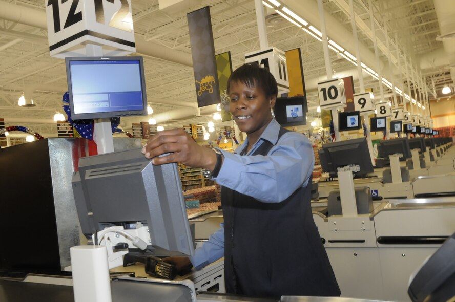 Jacqueline Henderson, Commissary Grocery Manager, checks out the cash registers in preparation for the grand opening of the commissary May 28. U. S. Air Force photo by Sue Sapp