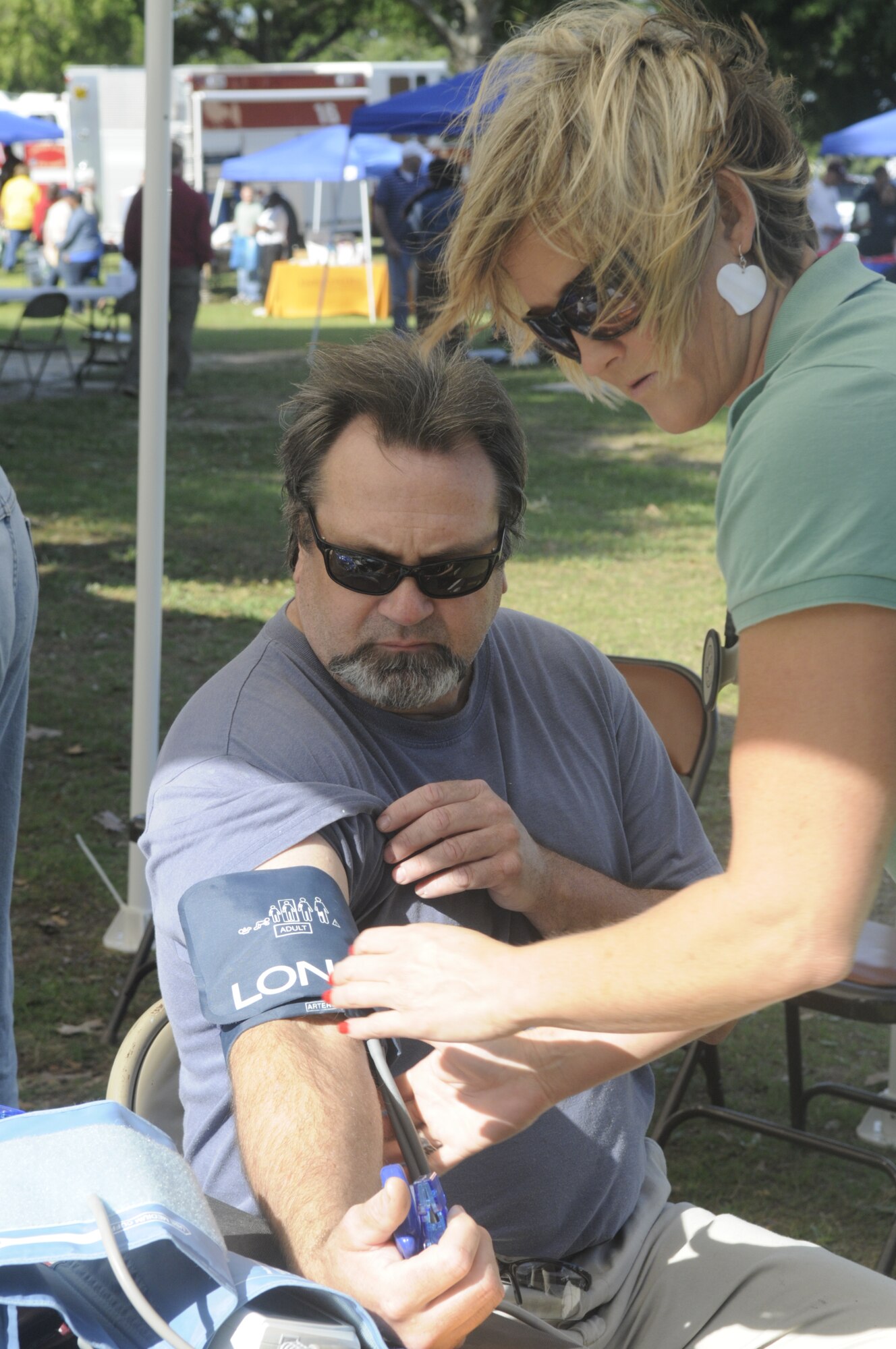 Kevin Brown, 402nd Maintenance Wing, has his blood pressure taken by April Gray, a wellness associate with the Civilian Health Promotion Service. U. S. Air Force photo by Sue Sapp