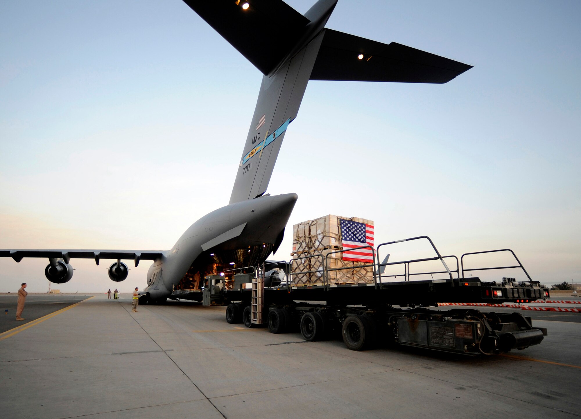 A pallet containing humanitarian relief supplies destined for Pakistan is prepared to be loaded into the cargo bay of a C-17 Globemaster III May 20 at an air base in Southwest Asia. (U.S. Air Force photo/Staff Sgt. Shawn Weismiller)