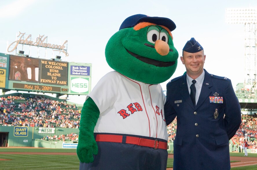 Outgoing Electronic Systems Center Chief of Staff Col. Russ Blaine poses with Boston Red Sox mascot Wally the Green Monster on the field at Fenway Park prior to the team’s May 19 game against the Toronto Blue Jays.  The Red Sox provided a special tribute to Colonel Blaine, who will formally retire from active-duty service in a 2 p.m. ceremony at the Minuteman Club May 21.  (USAF Photo by Mark Wyatt)