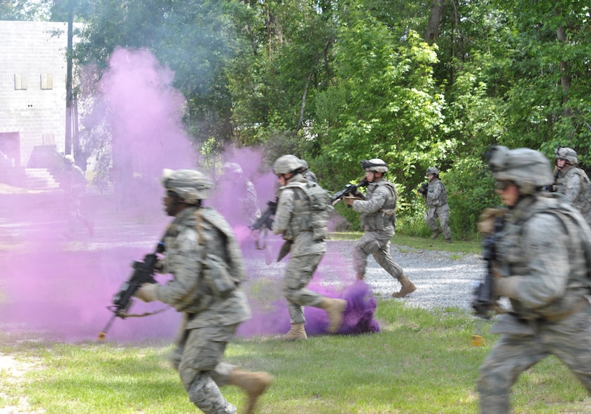 MOODY AIR FORCE BASE, Ga. -- Members from the 820th Security Forces Group are ambushed during a simulated patrol by enemy forces during a demonstration of the group’s ability to perform non-traditional ground assaults during the Moody Spouses Appreciation Day here May 15. This demonstration provided a rare insight into the specialized operations and abilities of the 820th SFG. (U.S. Air Force Photo by Staff Sgt. Javier Cruz Jr.)