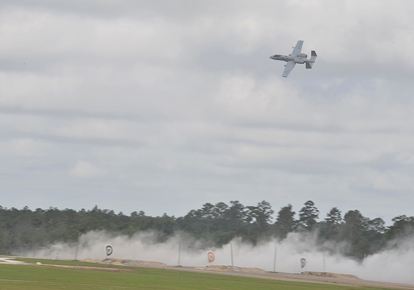 MOODY AIR FORCE BASE, Ga. -- An A-10C Thunderbolt II from the 75th Fighter Squadron, engages with a simulated enemy element that is closing in on the position of a downed pilot who is awaiting rescue during the Moody Spouses Appreciation Day here May 15. The aircraft was part of a live fire and rescue demonstration which gave an opportunity for military spouses to view a rare glimpse of part of Moody’s mission firsthand. (U.S. Air Force Photo by Staff Sgt. Javier Cruz Jr.) 