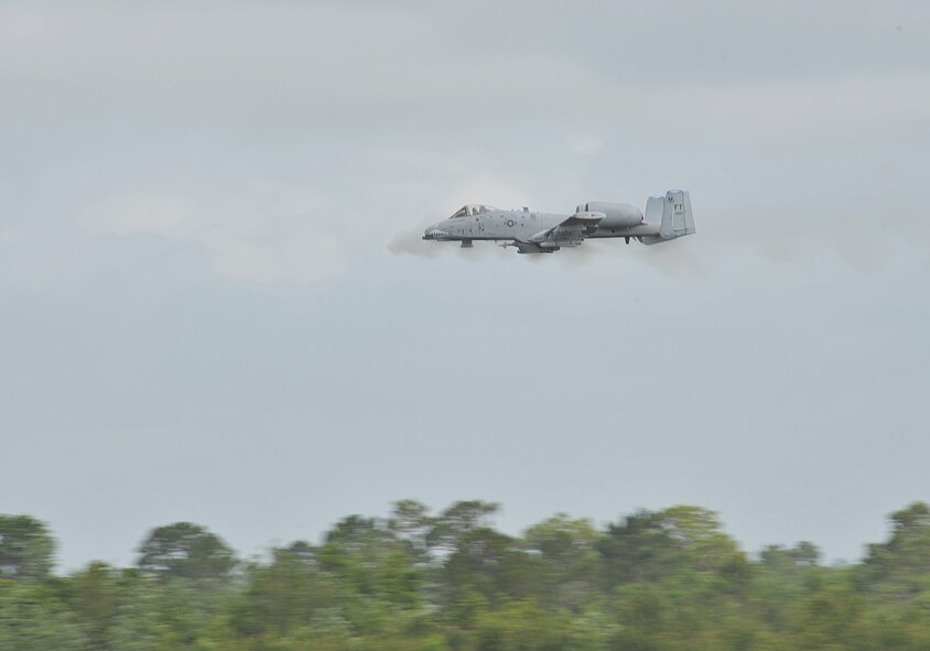 MOODY AIR FORCE BASE, Ga. -- An A-10C Thunderbolt II from the 75th Fighter Squadron, engages with a simulated enemy element that is closing in on the position of a downed pilot who is awaiting rescue during a live fire and rescue demonstration during the Moody Spouses Appreciation Day here May 15. (U.S. Air Force Photo by Staff Sgt. Javier Cruz Jr.)