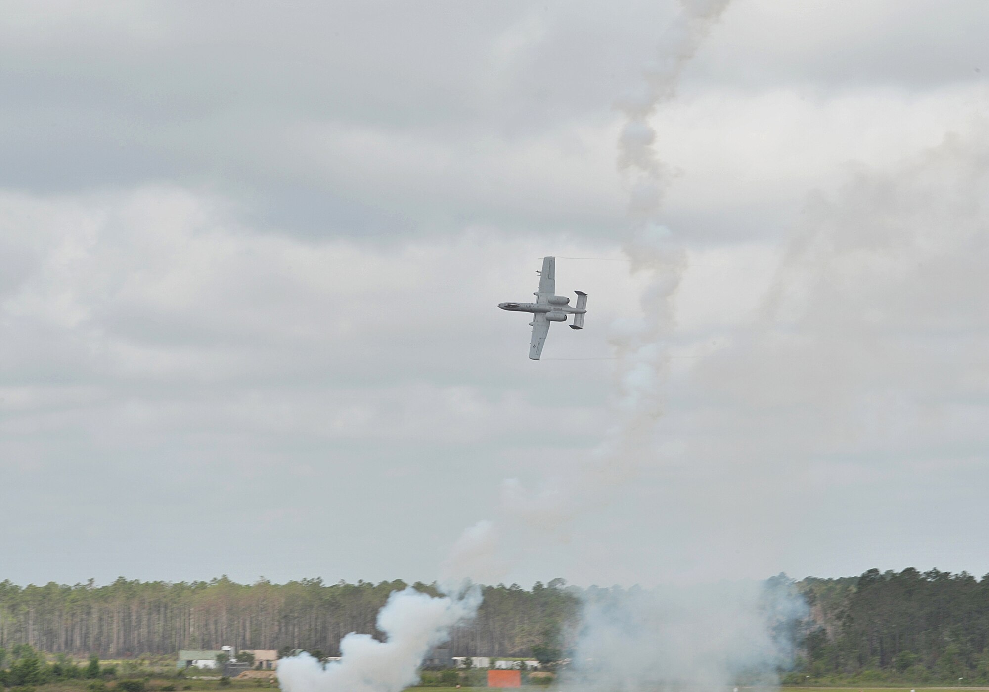 MOODY AIR FORCE BASE, Ga. -- An A-10C Thunderbolt II aircraft from the 75th Fighter Squadron, evades a simulated enemy missile launch during a demonstration held for the Moody Spouses Appreciation Day here May 15. The demonstration allowed viewers an opportunity to see what happens during a rescue mission. (U.S. Air Force Photo by Staff Sgt. Javier Cruz Jr.)