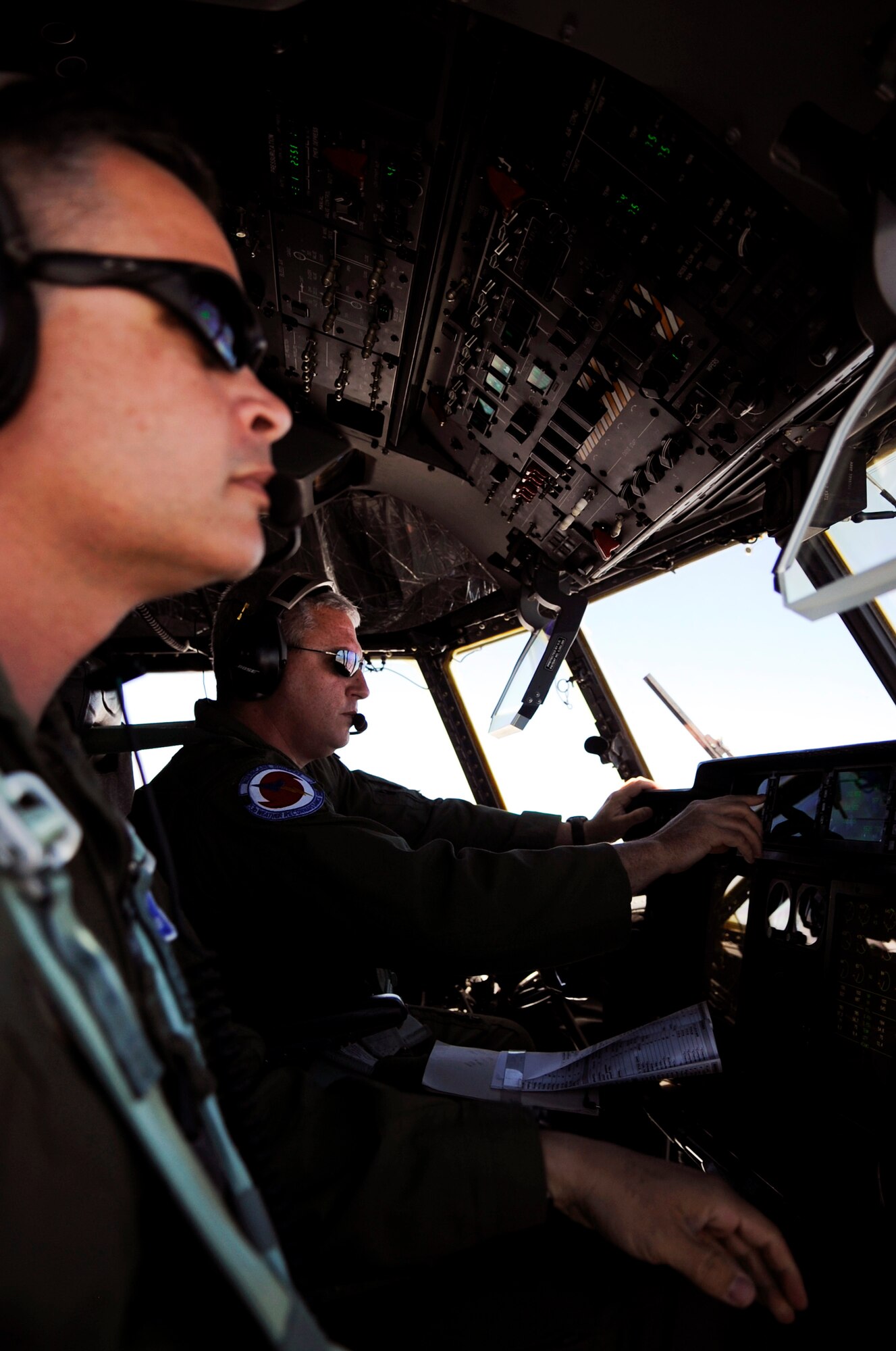 Capt. Shane Devlin and Maj. John Wagner fly a WC-130J "Hurricane Hunter" during the Air Force's first Blogger's Flight May 19.  Captain Devlin and Major Wagner are pilots assigned to the Air Force Reserve Command’s 53rd Weather Reconnaissance Squadron at Keesler Air Force Base, Miss.  Military bloggers were invited to fly with the 53rd WRS in a media day event. The training flight featured the unit’s weather reconnaissance mission as they prepare to enter hurricane season, which begins June 1. (U.S. Air Force photo/Staff Sgt. Desiree N. Palacios)