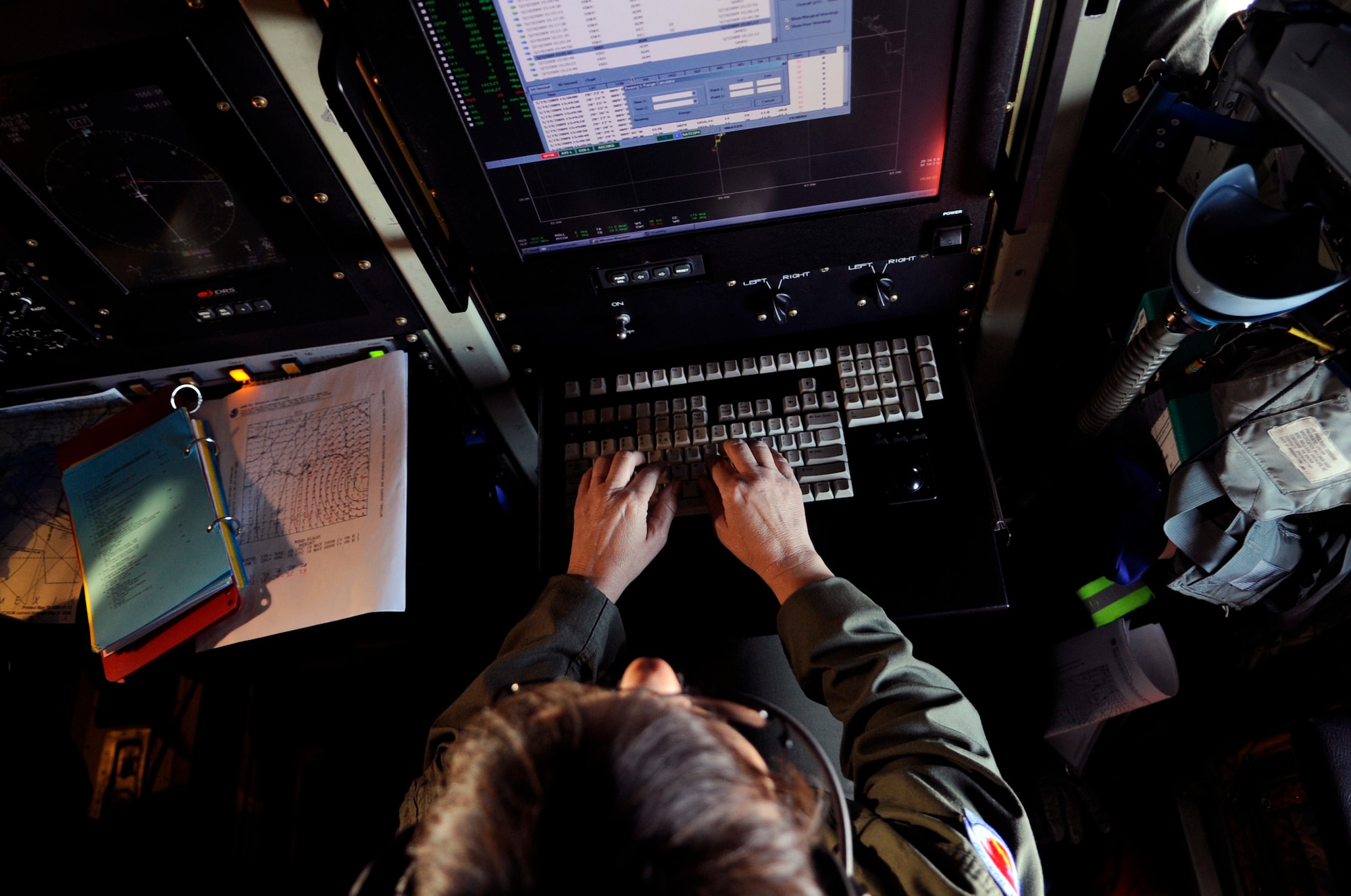 Lt. Col. Val Hendry, onboard a WC-130J "Hurricane Hunter," collects weather data during a training mission May 19.  A first for the Air Force, military bloggers were invited to fly with the crew on the mission.  Colonel Hendry is a flight meteorologist assigned to the Air Force Reserve Command's 53rd Weather Reconnaissance Squadron at Keesler Air Force Base, Miss.  The training flight featured the unit's weather reconnaissance mission as they prepare to enter hurricane season, which begins June 1. (U.S. Air Force photo/Staff Sgt. Desiree N. Palacios)