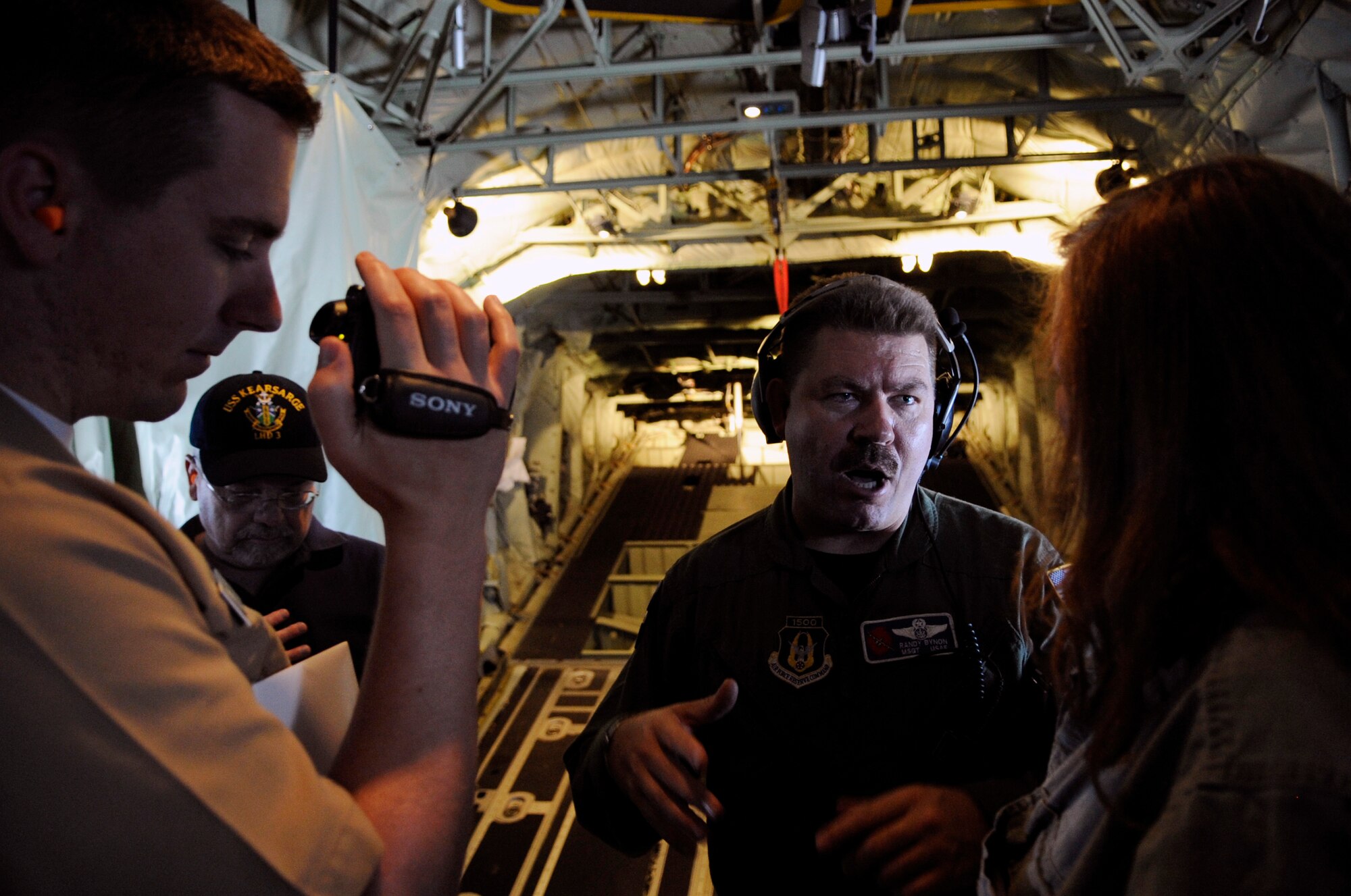 Master Sgt. Randy Bynon answers questions from military bloggers onboard a WC-130J "Hurricane Hunter" during a training mission May 19.  A first for the Air Force, military bloggers were invited to fly with the crew on the mission.  Sergeant Bynon is a loadmaster assigned to the 53rd Weather Reconnaissance Squadron at Keesler Air Force Base, Miss.  The training flight featured the unit's weather reconnaissance mission as they prepare to enter hurricane season, which begins June 1. (U.S. Air Force photo/Staff Sgt. Desiree N. Palacios)