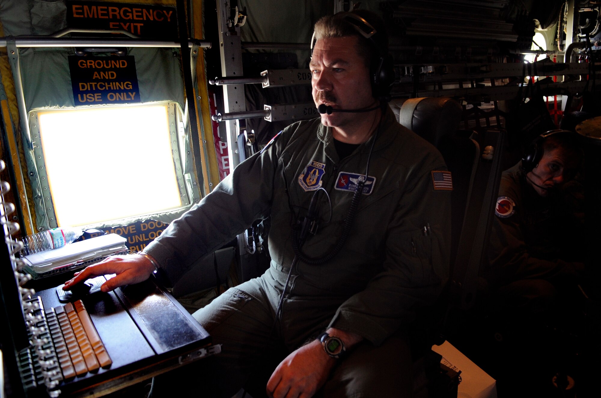 Master Sgt. Randy Bynon, onboard a WC-130J "Hurricane Hunter," prepares for landing during a training mission May 19.  A first for the Air Force, military bloggers were invited to fly with the crew on the mission.  Sergeant Bynon is a loadmaster assigned to the Air Force Reserve Command's 53rd Weather Reconnaissance Squadron at Keesler Air Force Base, Miss.  The training flight featured the unit's weather reconnaissance mission as they prepare to enter hurricane season, which begins June 1. (U.S. Air Force photo/Staff Sgt. Desiree N. Palacios)