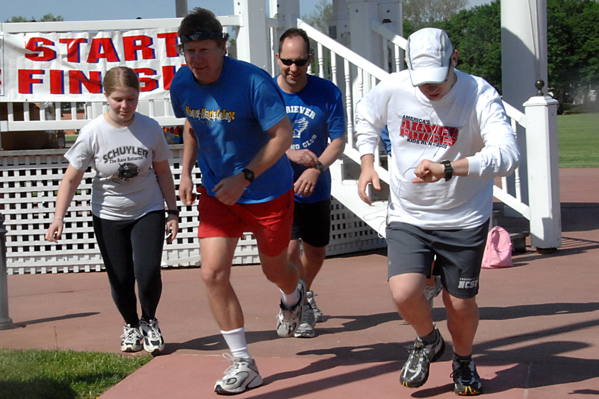 Offutt Air Force Base, Neb.-- Members of Team Offutt begin the 5K race during America's Armed Forces Kids Run at the parade grounds here May 16. America's Kids Run is an event that promotes fitness, while providing a safe and fun activity for military children. Run participants received a t-shirt, water bottle and jump rope. U.S. Air Force photo by Kendra Williams