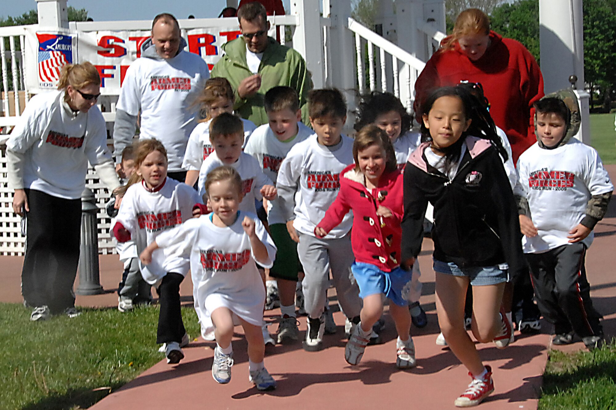 OFFUTT AIR FORCE BASE, Neb. -- Children of Offutt servicemembers begin the one-mile race during America's Armed Forces Kids Run at the parade grounds here May 16. America's Kids Run is an event that promotes fitness, while providing a safe and fun activity for military children. Run participants received a T-shirt, water bottle and jump rope. U.S. Air Force photo by Kendra Williams