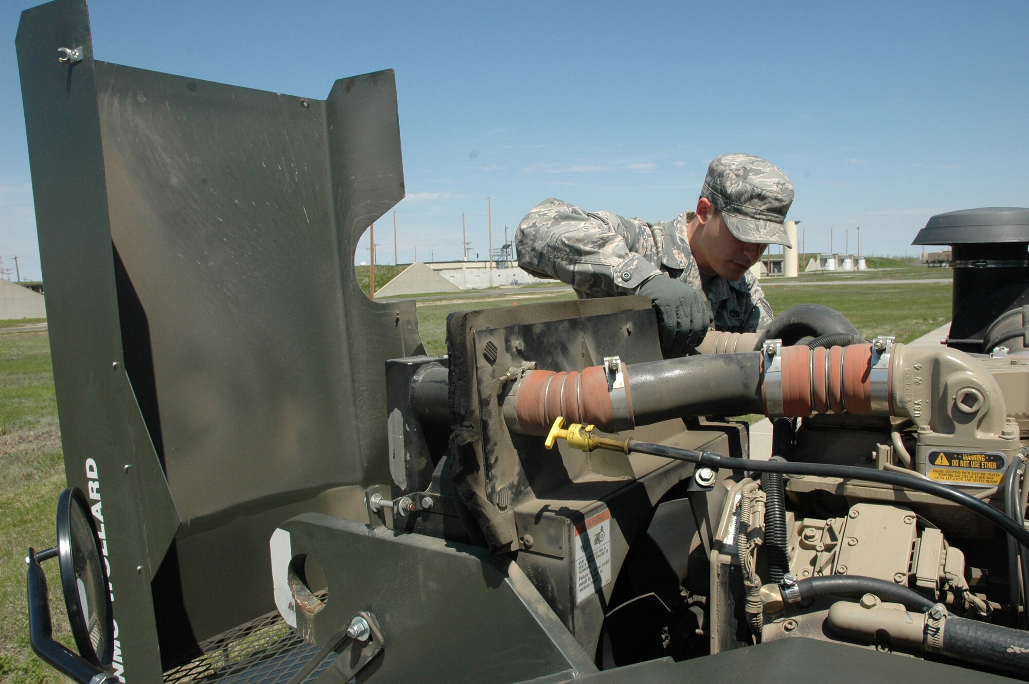 MINOT AIR FORCE BASE, N.D. – Staff Sgt. Steven Adams, 5th Munitions Squadron, performs a vehicle inspection on a tug at the Weapons Storage Area during a Nuclear Surety Inspection here May 19. An NSI is designed to evaluate a unit's readiness to execute nuclear operations. Areas to be evaluated during the NSI include operations, maintenance, security, and support activities needed to ensure the wing performs its mission in a safe, secure and reliable manner. This no-notice inspection is expected to conclude May 22. (U.S. Air Force photo by Senior Airman Wesley Wright)