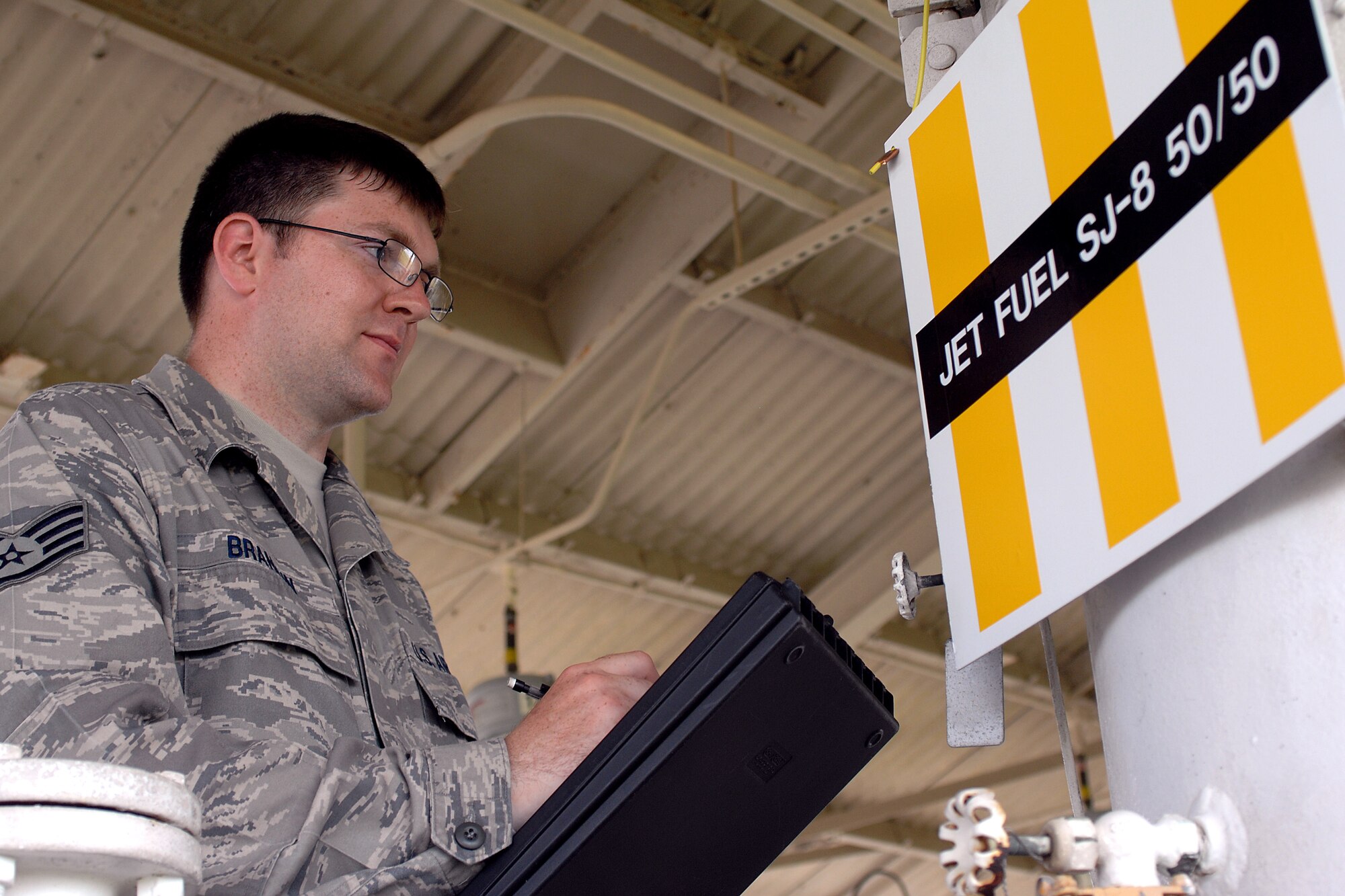 Staff Sgt. Stuart Branigin, 4th Logistics Readiness Squadron fuels specialist, checks a pressure gauge on a fuel filter separator near the fuel pump-house on the flightline at Seymour Johnson Air Force Base, N.C., May 8, 2009. Airmen from the fuels management flight prepared for the synthetic fuel by repeated testing to ensure stringent quality requirements were met. (U.S. Air Force photo by Staff Sgt. Shawn J. Jones)