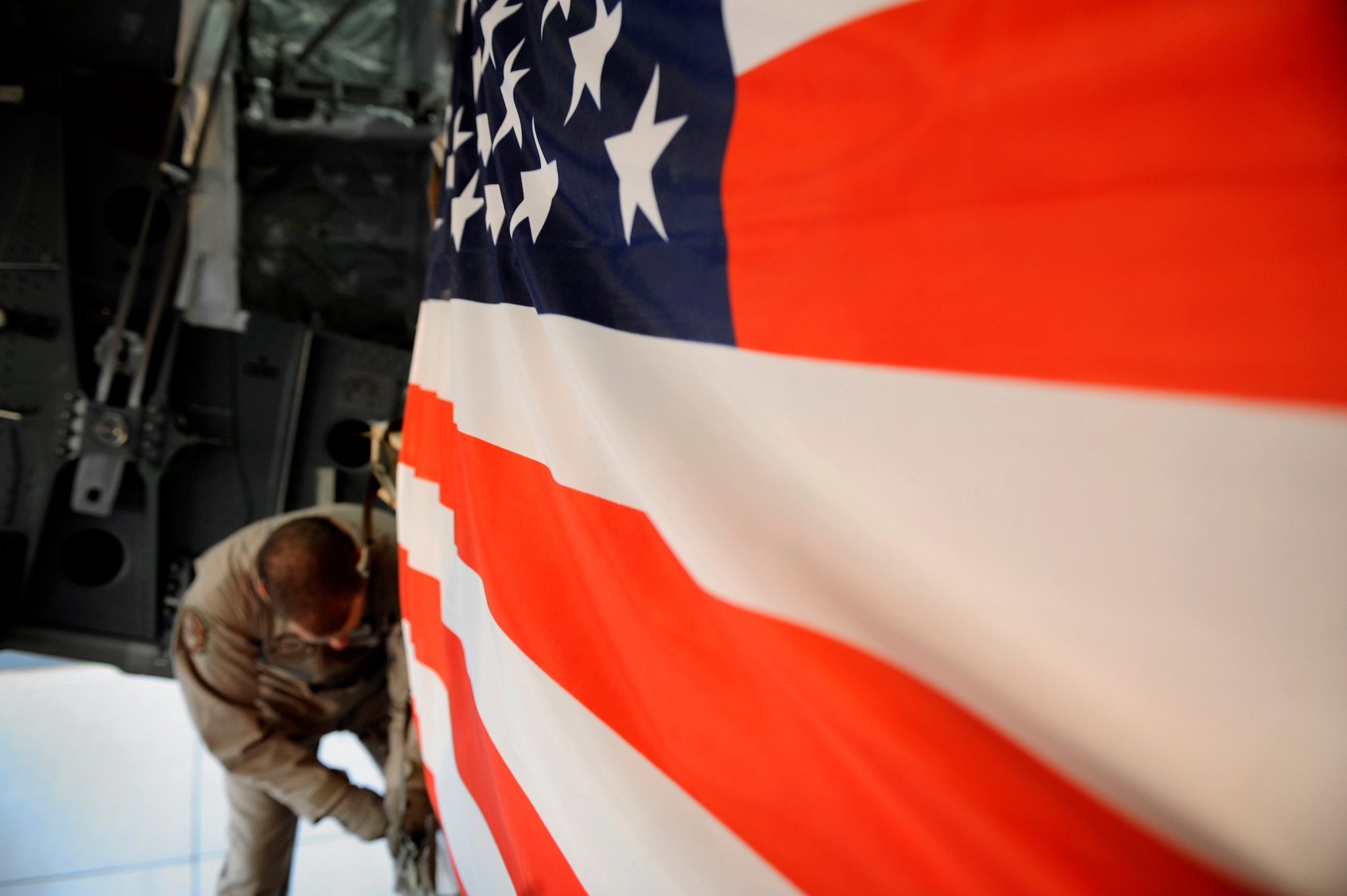 U.S. Air Force Staff Sgt. Jonathan Lanza, a loadmaster assigned to the 816th Expeditionary Airlift Squadron, secures a pallet containing humanitarian relief supplies destined for Pakistan into the cargo bay of a C-17 Globemaster III May 20, 2009, at an undisclosed location in Southwest Asia . (U.S. Air Force photo by Staff Sgt. Shawn Weismiller)