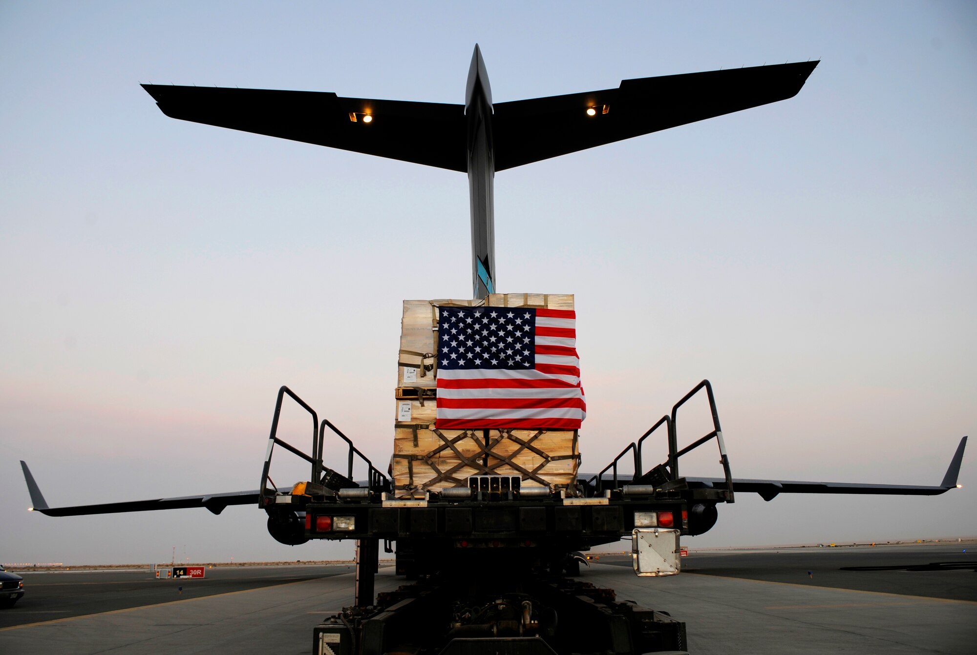 A pallet containing humanitarian relief supplies destined for Pakistan is prepared to be loaded into the cargo bay of a C-17 Globemaster III May 20, 2009, at an undisclosed location in Southwest Asia. (U.S. Air Force photo by Staff Sgt. Shawn Weismiller)