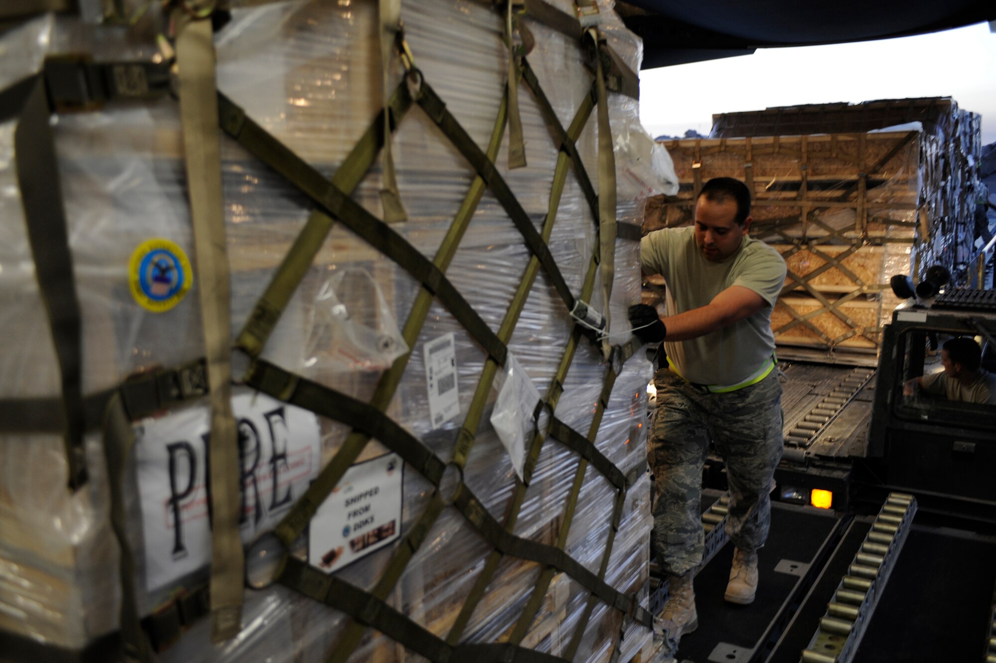 U.S. Air Force Master Sgt. Thomas J. Kondziella loads a pallet containing humanitarian relief supplies destined for Pakistan into the cargo bay of a C-17 Globemaster III May 20, 2009, at an undisclosed location in Southwest Asia. (U.S. Air Force photo by Staff Sgt. Shawn Weismiller)