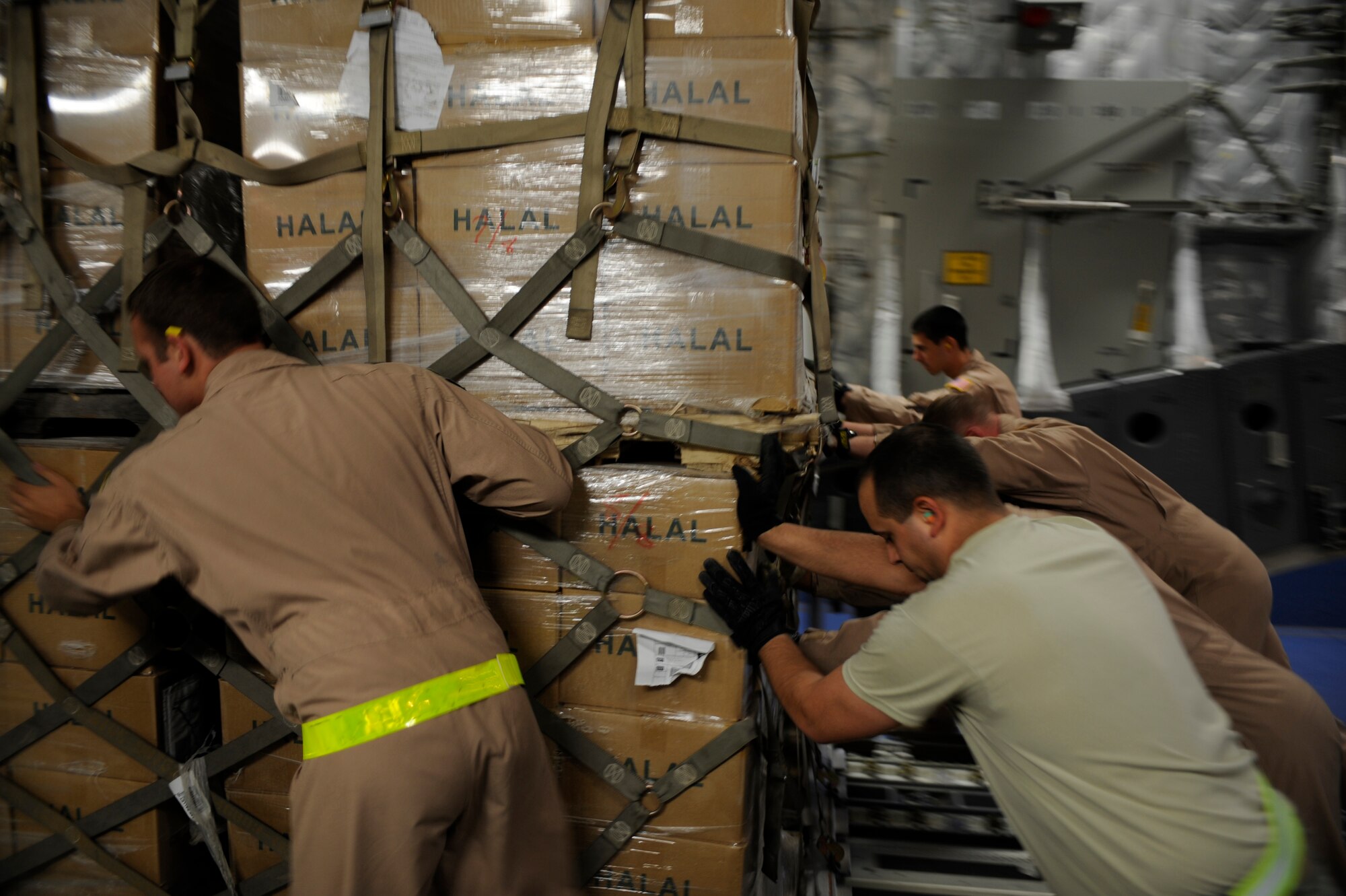 U.S. Air Force Airmen load a pallet containing humanitarian relief supplies destined for Pakistan into the cargo bay of a C-17 Globemaster III May 20, 2009, at an undisclosed location in Southwest Asia. (U.S. Air Force photo by Staff Sgt. Shawn Weismiller)