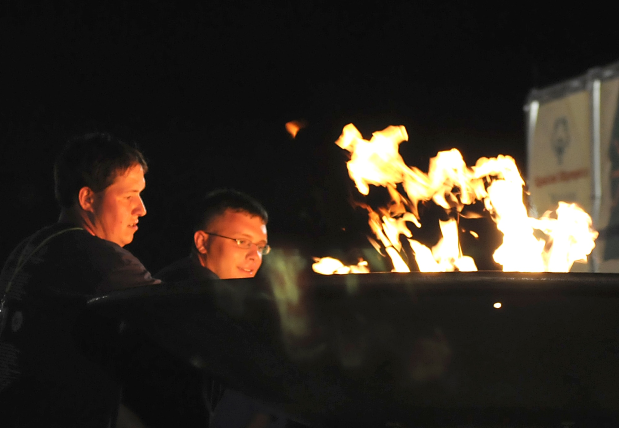 Area 8 athlete Luke Robinson, left, and Senior Airman Caleb Foy, 81st Security Forces Squadron, light the flame to open the 2009 Mississippi Special Olympics Summer Games at Keesler Friday.  The base hosted more than 1,300 athletes and coaches during the weekend.  The base has been the site for the state games since 1982.  About 3,000 volunteers helped to make the event a success.  (U.S. Air Force photo by Kemberly Groue)