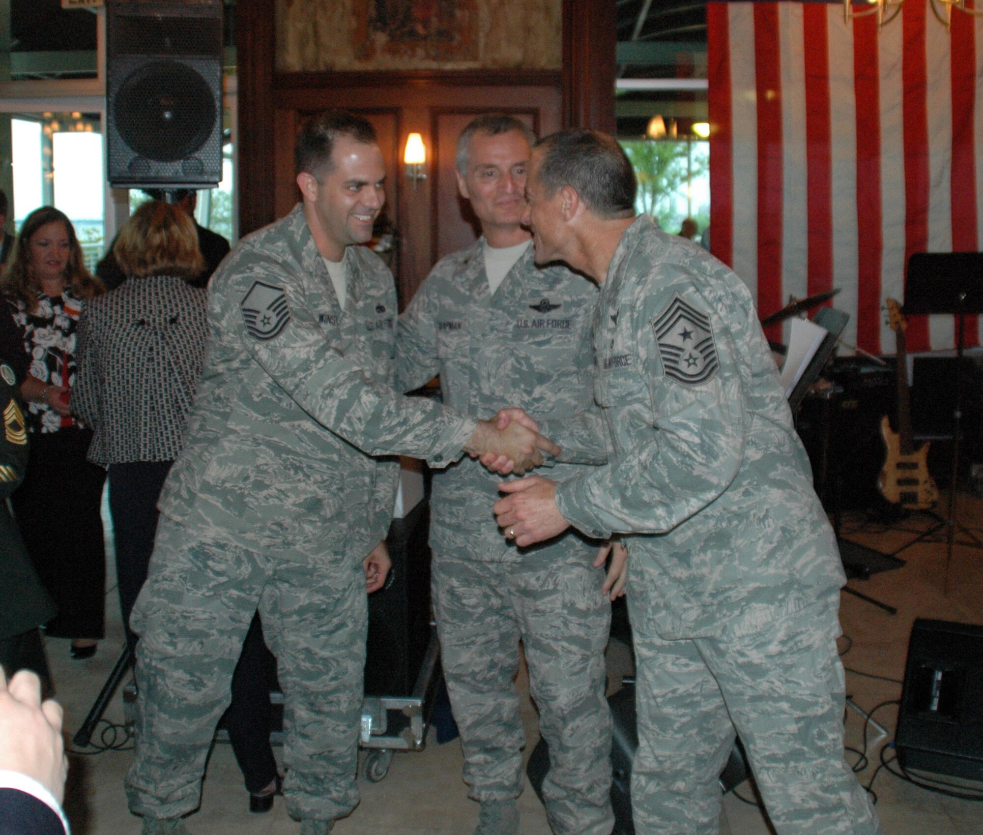 Colonel Steven Chapman, Commander of the 315 Airlift Wing, Charleston AFB, S.C. and Chief Master Sergeant Ben Futrell, Command Chief Master Sergeant of the 315 AW congratulate Technical Sergeant Tony Winstead on receiving the Charleston Metro Chamber of Commerce Reservist of the Year Award.

Tech. Sgt. Winstead competed against award recipients from each military branch.  In addition to being a reservist with the 315 AW, Tech. Sgt. Winstead is also a full time police officer for the Town of Mt. Pleasant.  Additionally, he organized his squadron’s Combined Federal Campaign drive and exceeded his goal.  He helped raise funds for his unit’s association for a summer picnic for reserve members and their families.  He also logged over 220 volunteer hours dedicated to the community which includes being a den leader for Cub Scout Pack 63 and served as a coach for the Charleston City Recreation Department.  
