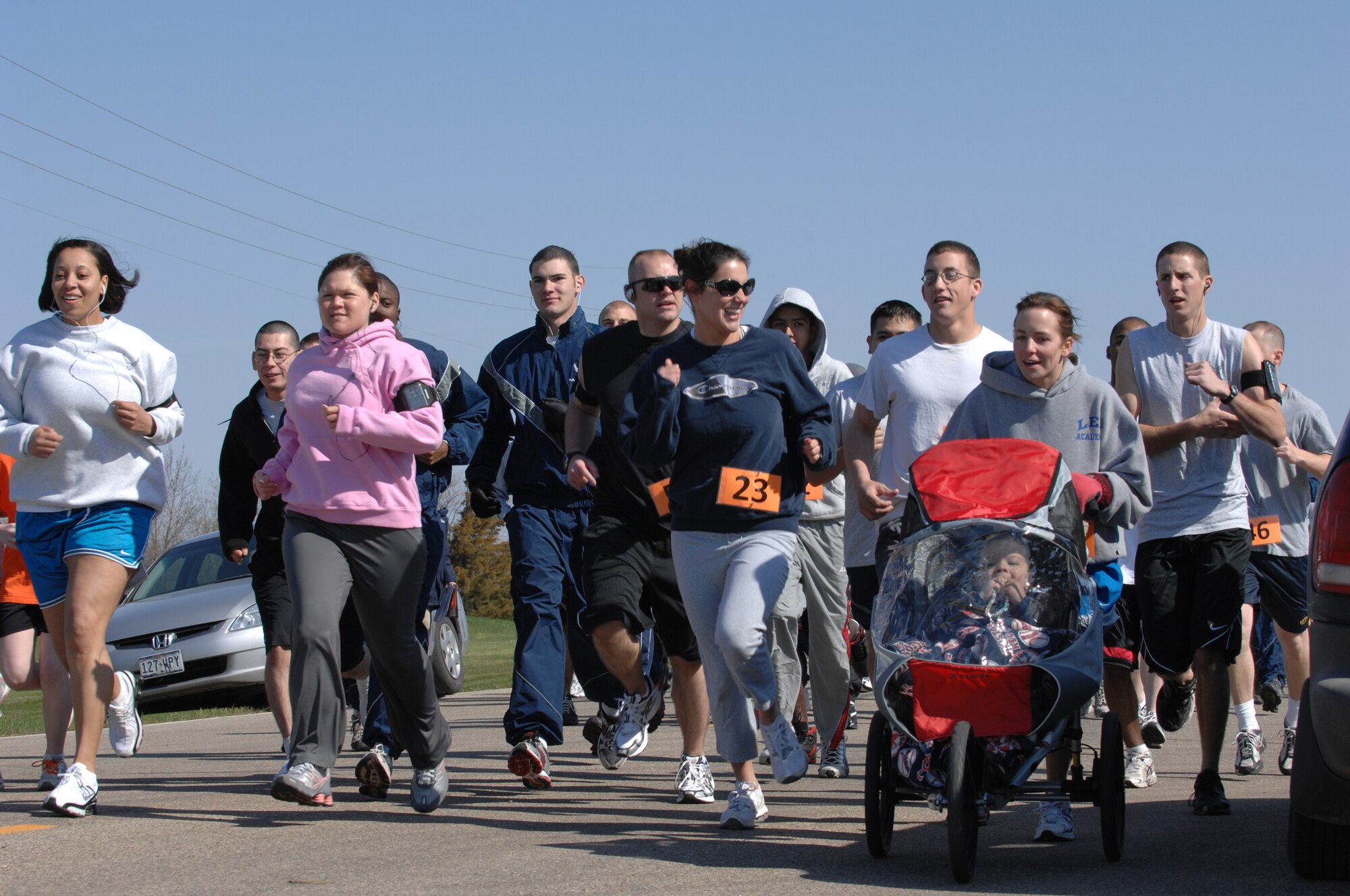 MINOT AIR FORCE BASE, N.D. -- Kids and adults participate in the Why Not Run event here May 16. The event was hosted by the 5th Force Support Squadron to promote physical fitness and team building. (U.S. Air Force photo by Staff Sgt. Angel Gallardo)