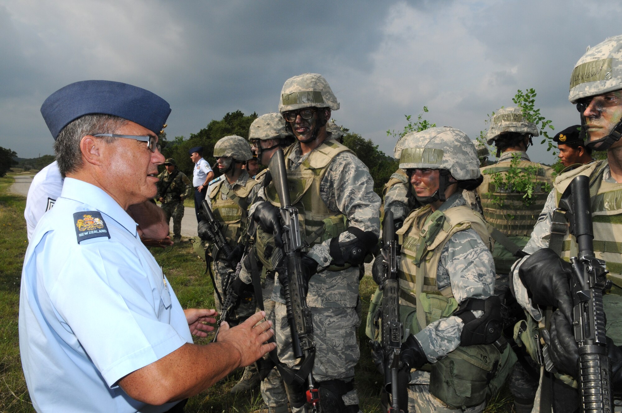 New Zealand air force Chief Master Sgt. Keith Gell speaks with U.S. Air Force trainees at Camp Bullis, Texas, during the 2009 Worldwide Senior Enlisted Leaders Summit May 12-15. The visit was hosted by U.S. Air Force senior enlisted leaders to give their foreign counterparts a look at a U.S. Air Force enlisted member's career from start to finish. (U.S. Air Force photo/Rich McFadden)