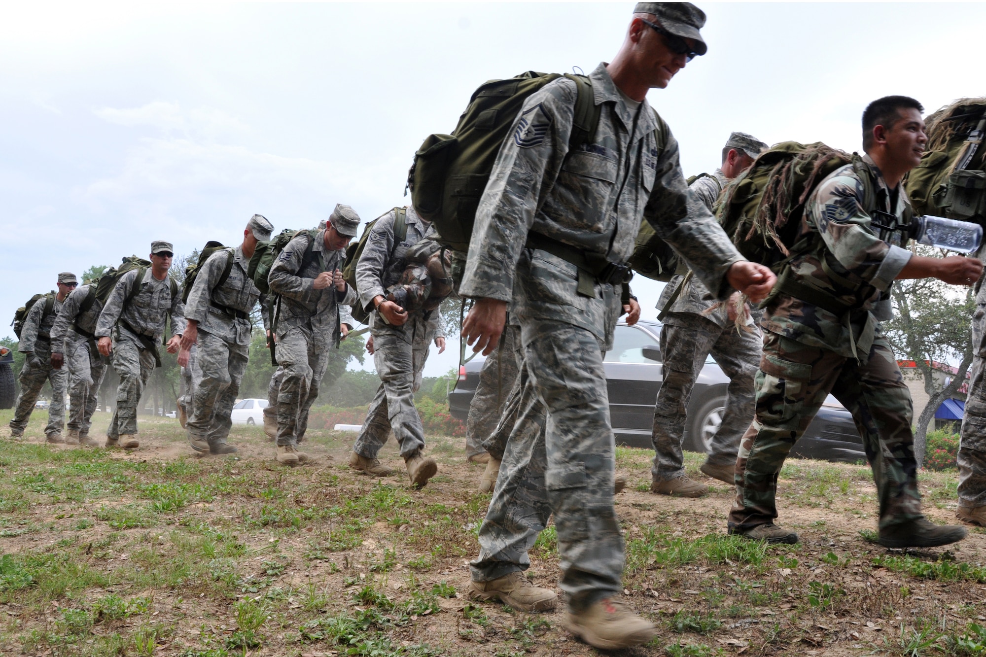 Members from the 96th Ground Combat Training Squadron march as a unit for three miles May 15 around Eglin Air Force Base in honor of National Police Week. Police Week honors personnel in law enforcement as well as pay tribute to officers who have fallen in the line of duty. The ruck ended at the All Wars Memorial where a retreat ceremony was held. (U.S. Air Force photo/ Airman Anthony Jennings)