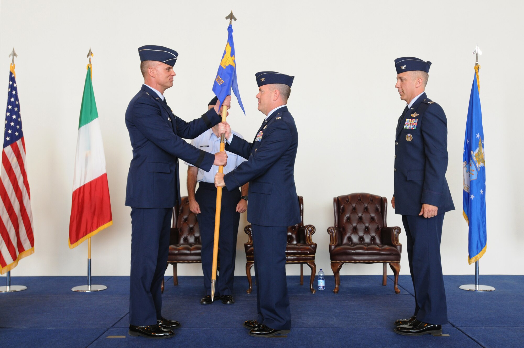 Brig. Gen. Craig Franklin, 31st Fighter Wing commander, hands Col. Patrick Miller the group guidon during the 31st Operations Group change of command ceremony at Aviano Air Base, Italy, May 19, 2009. Colonel Miller took command from Col. Thomas Gould who has been selected for reassignment as commander, 435th Air Base Wing, Ramstein Air Base, Germany. (U.S. Air Force photo/ Staff Sgt. Patrick Dixon)