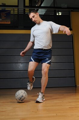United States Capt. Edward Jones, 3rd Air Force member, kicks a ball, May 4, 2009, Ramstein Air Base, Germany. Capt. Jones has scored a perfect 100 on his physical training test seven consecutive times. (U.S. Air Force photo by Senior Airman Nathan Lipscomb) 