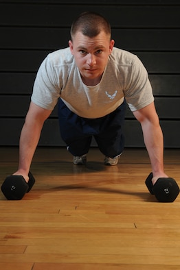 United States Air Force Staff Sgt. Brian Hiatt, 86th Operation Support Squadron member, performs pushups, May 4, 2009, Ramstein Air Base, Germany. Sergeant Hiatt has scored a perfect 100 on his physical training test seven consecutive times. (U.S. Air Force photo by Senior Airman Nathan Lipscomb)