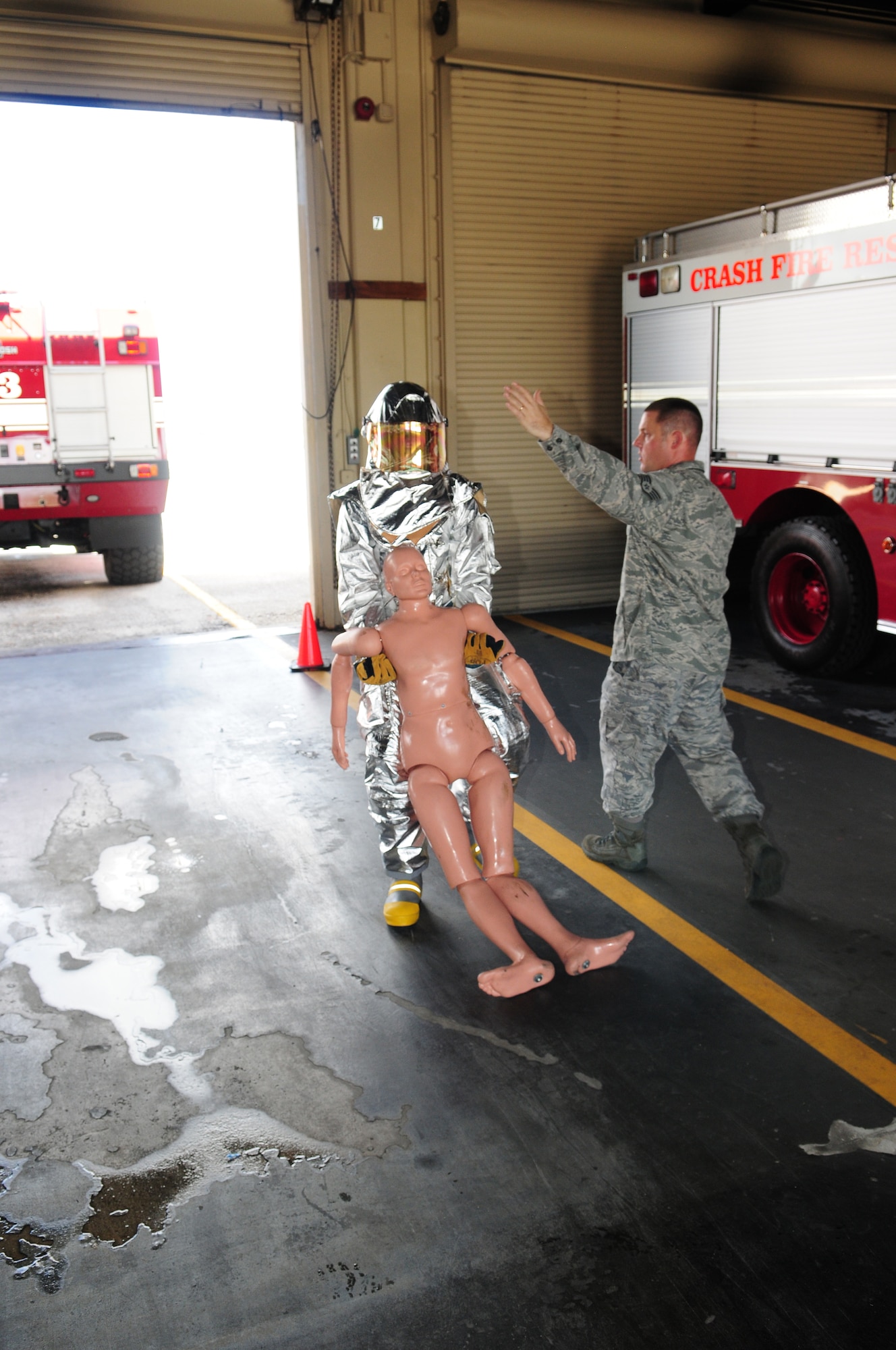 ANDERSEN AIR FORCE BASE, Guam -- A United States Air Force Academy cadet drags a 135-pound dummy in one of nine sections in a firefighter physical training competition May 19. The fire house offered a unique perspective for the third year cadets. The cadets observed enlisted personnel in action in leadership positions. (U.S. Air Force photo by Tech. Sgt. Michael Boquette)