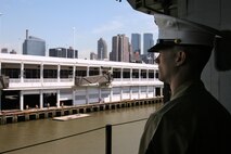 NEW YORK – Sgt. Chad Stuber looks at the New York City skyline from the hangar deck of the USS Iwo Jima May 20. Stuber is an explosive ordnance technician with Special Purpose Marine Air Ground Task Force New York. The Marines and Sailors of SPMAGTF—New York are participating in Fleet Week May 20-28.