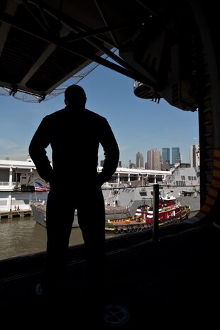 Petty Officers 3rd Class Michael Georgtadis, an aviation ordnanceman from Mt. Holly, N.J., looks over the deck of the USS Iwo Jima at Manhattan, May 20. The USS Iwo Jima is docked in Pier 88 as part of Fleet Week 2009. "It's great being home, and I'm looking forward to catching some baseball games," said Georgtadis, who recently returned from a deployment to Afghanistan.