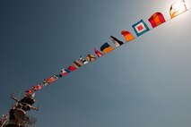 Flags fly over the deck of the USS Iwo Jima that is docked in Pier 88  in Manhattan, May 20. The USS Iwo Jima is in New York City as part of Fleet Week 2009.
