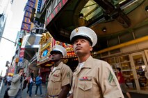 Cpl. John Brown, artillerymen of Dalton, Ga., and Cpl. Jamal Fredericksen, a food services specialist of Christian St. Croix, both part of 3rd Battalion, 10th Marine Regiment, 2nd Marine Division, enjoy a walk through Times Square, May 20. Brown and Fredericksen are in Manhattan as part of Fleet Week 2009. "I love New York, this has already been a great experience, and we just got here."