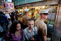 Marines visiting New York City as part of Fleet Week 2009 stop at a local street vendor to purchase a drink during a walk through Times Square, May 20.