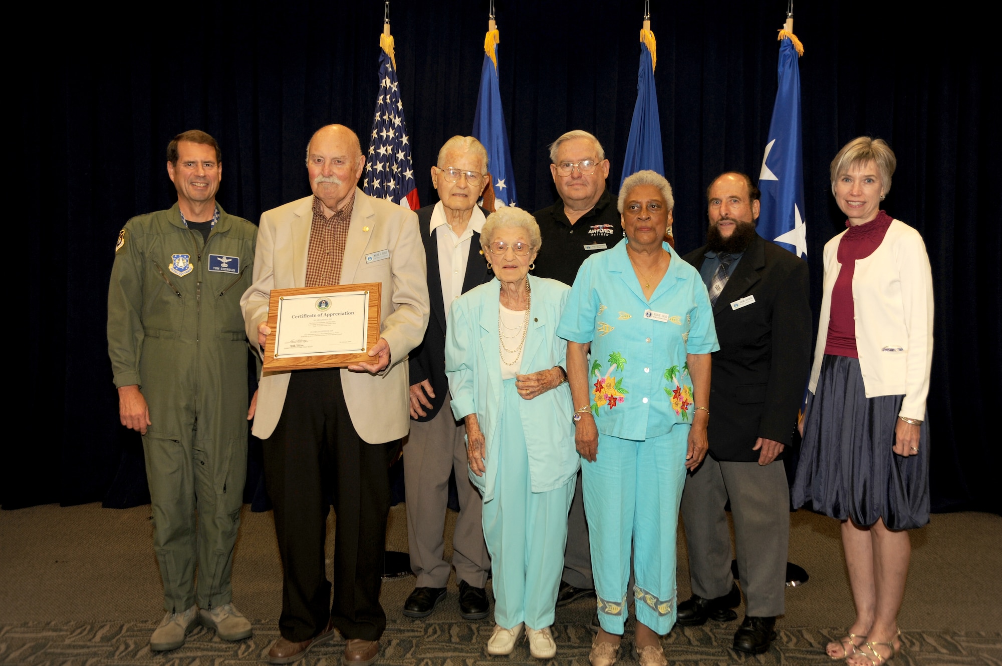 Lt. Gen. and Mrs. Sheridan  are pictured with members of the winning the Retiree Activities Office team