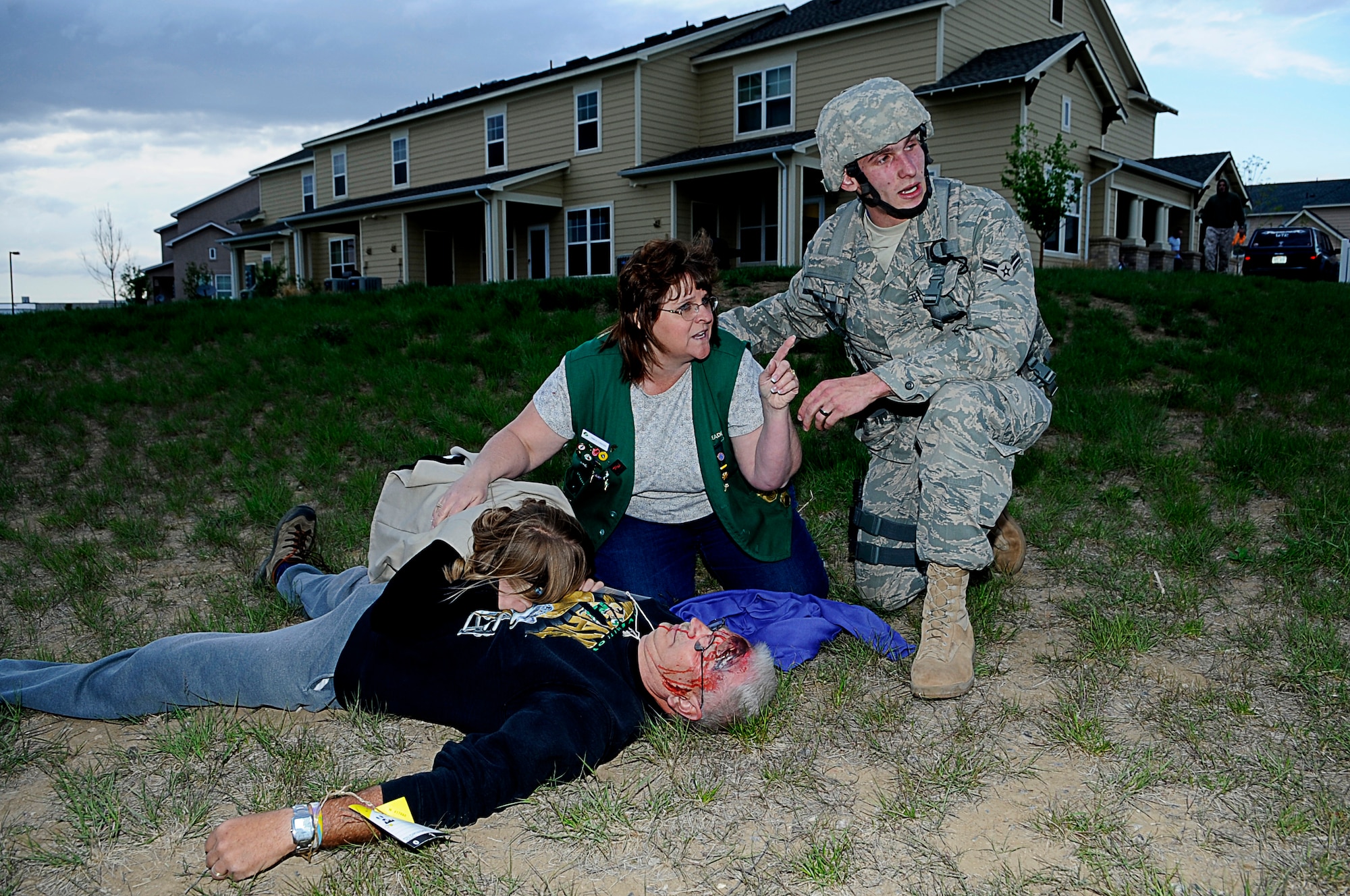 BUCKLEY AIR FORCE BASE, Colo. -- An Airman from the base's 460th Security Forces Squadron here, responds to Buckley Family Housing after a mock fuel-tanker truck exploded at a mock wedding held at the community center, May 15, in support of the Vigilant Front Range exercise. The exercise involved federal, state and local agencies working with base agencies to test plans and build understanding, trust and relationships essential in the fast-paced environment of major disasters. (U.S. Air Force photo by Tech. Sgt. Jeromy Cross)