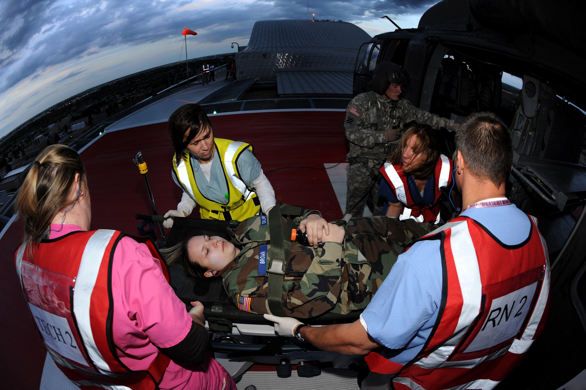 BUCKLEY AIR FORCE BASE, Colo. -- Denver Children's Hospital emergency care workers transport simulated wounded volunteer victims from a Colorado Army National Guard Blackhawk in support of the Vigilant Front Range exercise, May 15. The exercise involved federal, state and local agencies working with base agencies to test plans and build understanding, trust and relationships essential in the fast-paced environment of major disasters. (U.S. Air Force photo by Senior Airman Erika Brooke)