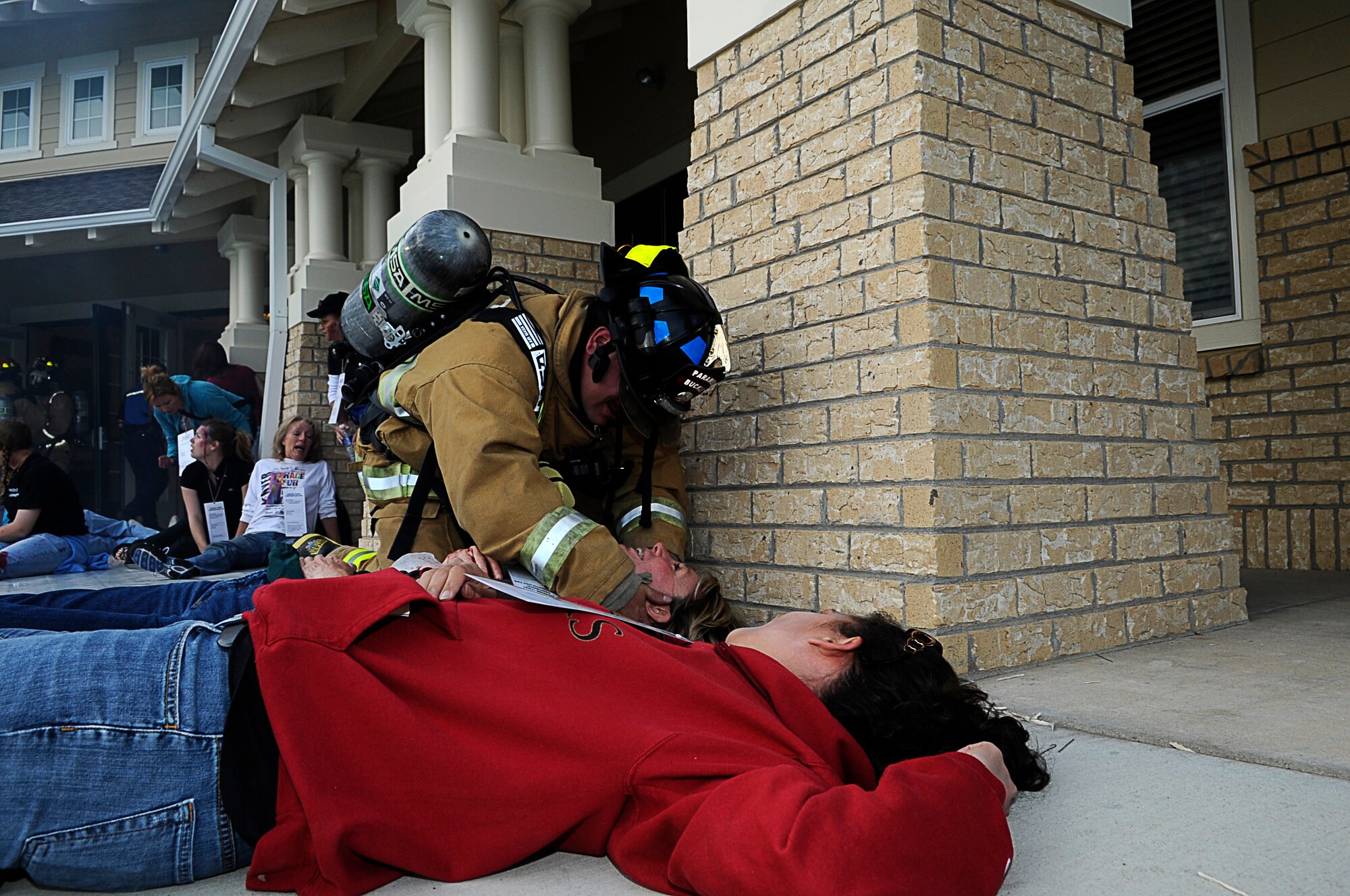 BUCKLEY AIR FORCE BASE, Colo. -- The Buckley Fire Department responded to the community center at Buckley Family Housing after a mock fuel-tanker truck exploded at a mock wedding here May 15, in support of the Vigilant Front Range exercise. The exercise involved federal, state and local agencies working with base agencies to test plans and build understanding, trust and relationships essential in the fast-paced environment of major disasters. (U.S. Air Force photo by Tech. Sgt. Jeromy Cross)