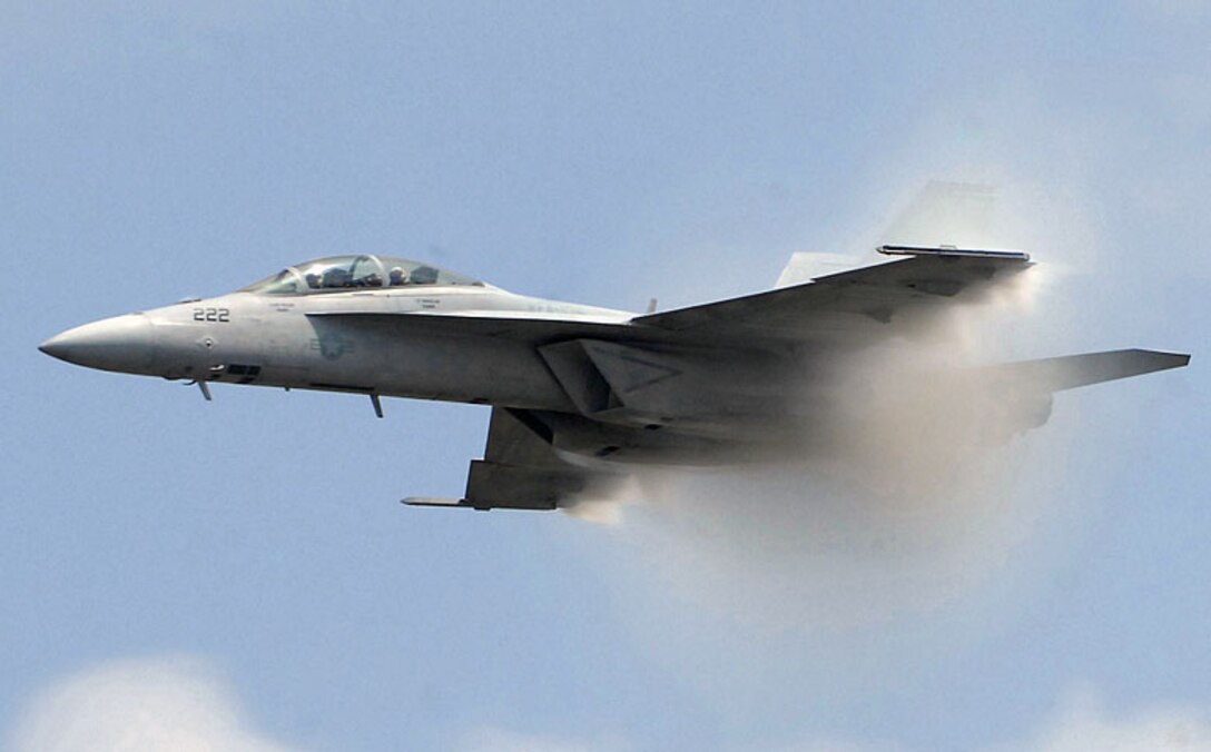 An F/A-18E Super Hornet performs a high speed pass over the crowd during the JSOH May 16. The JSOH celebrates military history while showcasing the future capabilities of the world's finest military force. (U.S. Air Force photo/ Senior Airman Giang Nguyen)