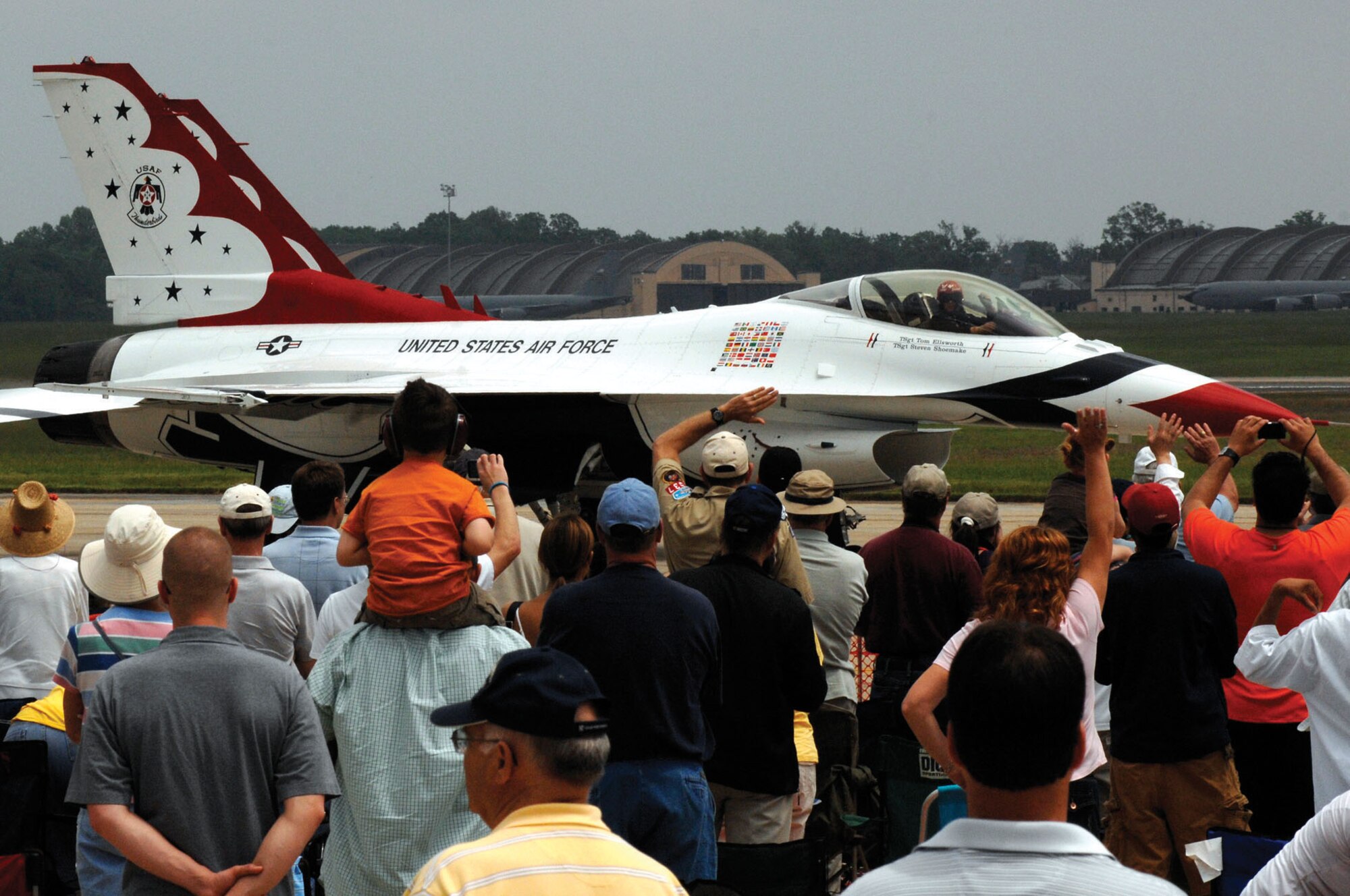 Spectators wave at a U.S. Air Force Thunderbirds pilot as he prepares for takeoff during the Joint Services Open House May 15 at Andrews. JSOH allows members of the public an excellent opportunity to meet and interact with the men and women of the Armed Forces. (U.S. Air Force photo/ Airman 1st Class Melissa Rodrigues)