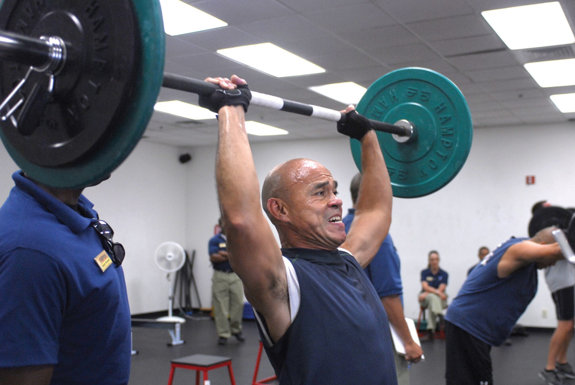 Retired Master Sgt. Tony Castro lifts a 75 pound barbell during the 2009 Luke CrossFit Games “Fight Gone Bad” competition held in the CrossFit Gym May 15. (U.S. Air Force photo/ Airman 1st Class Tracie Forte)