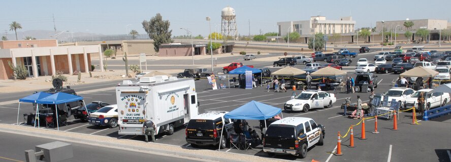 The 56th Security Forces Squadron and local law enforcement held a Police Week Expo Saturday at the Luke Air Force Base exchange parking lot. The event included K-9 demonstrations, a weapons display, Project Child I.D., face painting, an appearance by McGruff the Crime Dog and representatives from Project Childsafe. (U.S. Air Force photo/ Airman 1st Class Sandra Welch)