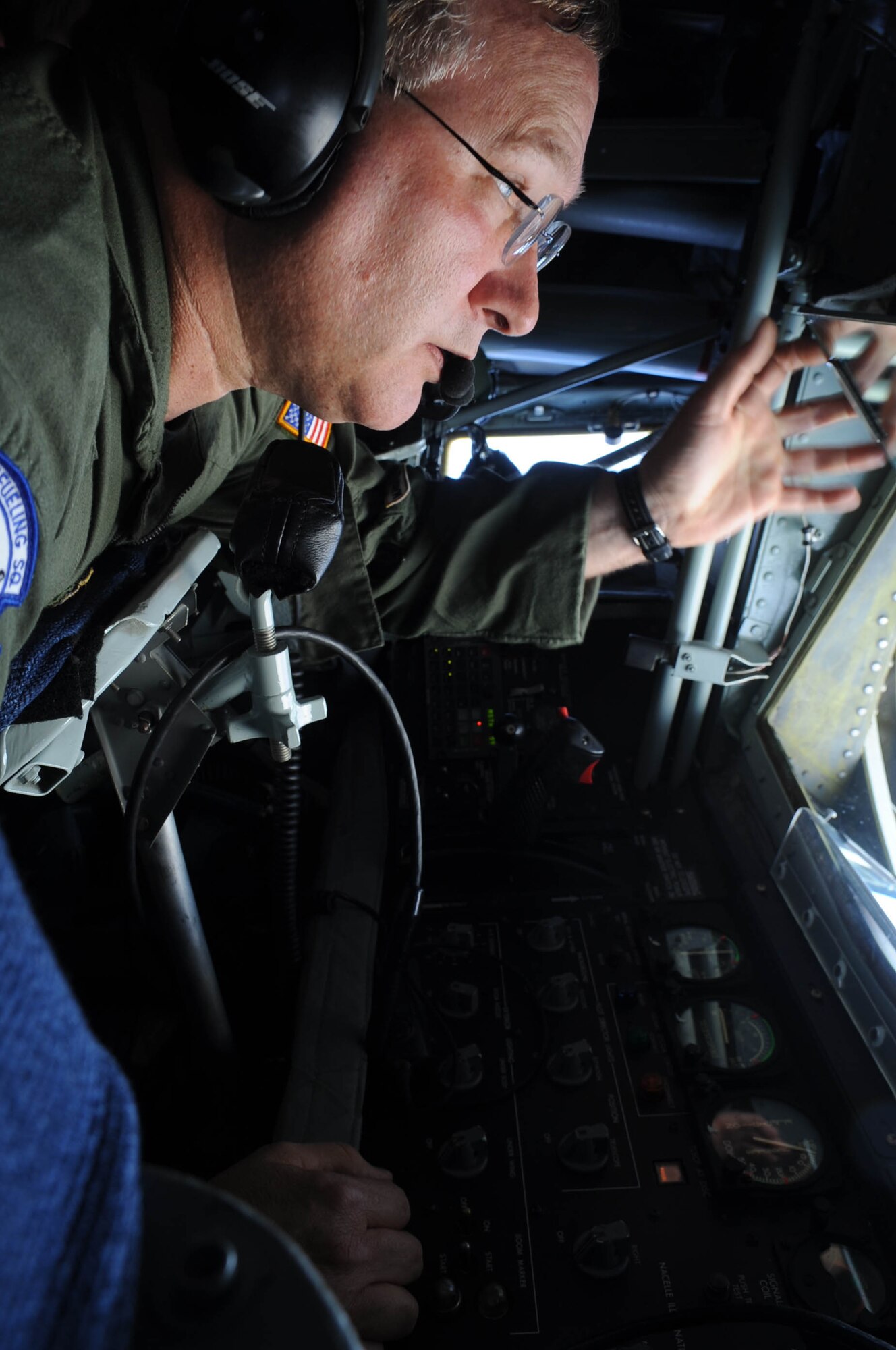 Senior Master Sgt. Phil Stidaham, 506th Expeditionary Air Refueling Squadron boom operator, positions a boom before refueling a B-2 Spirit May 12.  More than 100 Airmen and four KC-135 Stratotankers from the 452nd Air Mobility Wing, March Air Reserve Base, Calif., deployed here at the end of April. (U.S. Air Force photo by Senior Airman Christopher Bush)