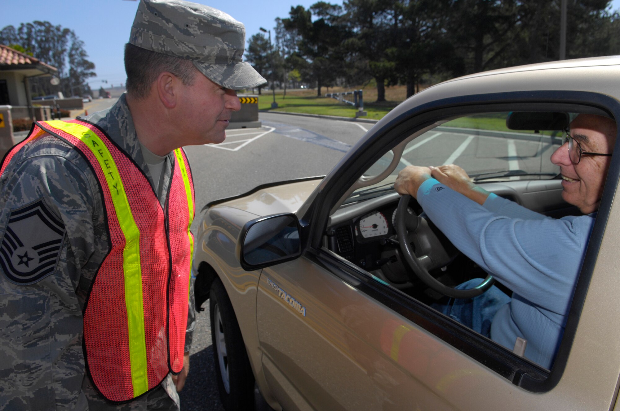 VANDENBERG AIR FORCE BASE, Calif. --  Senior Master Sgt. Rob Bedell, the chief enlisted manager of the 30th Launch Group, stops a driver exiting the Santa Maria Gate to ensure that he is wearing a seat belt here May 21. The 101 Critical Days of Summer kicked off May 20. All of Team V is reminded to remain safe and use common sense when it comes to traveling and participating in outdoor activities.   (U.S. Air Force photo/Airman 1st Class Andrew Lee) 