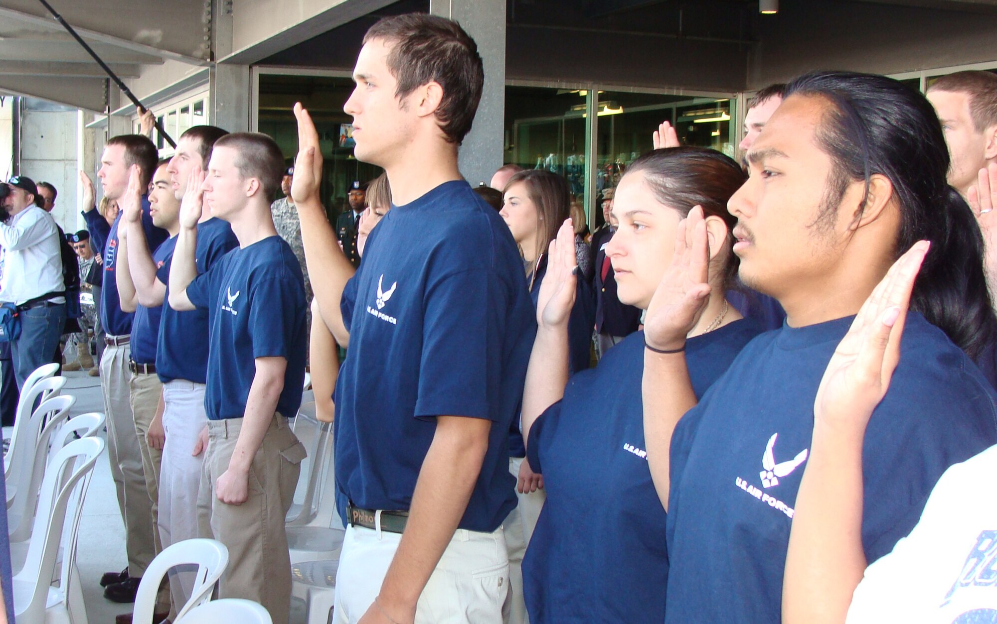 Six members of the Air Force delayed entry program recite the oath of enlistment administered by Indiana Senator Richard Lugar during a ceremony May 17 at the Indianapolis Motor Speedway. The speedway recognizes the contributions of military men and women annually during Armed Forces Day weekend. The Indianapolis 500 May 24 features the debut of an Air Force-themed Indy car driven by rookie Rafael Matos, who qualified 12th and starts from the fourth row. (U.S. Air Force photo/Daniel Elkins)