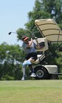 Army 1st Sgt. Bobby Golden, from the Center for the Intrepid at Brooke Army Medical Center, plays a round of golf May 19 at the Randolph Oaks Golf Course at Randolph Air Force Base, Texas. The base Services Division hosted a group of wounded warriors at the golf course for a day of rest and relaxation to show thier appreciation. (U.S. Air Force photo by Steve White)