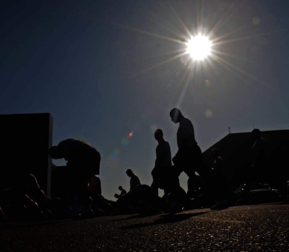 LANGLEY AIR FORCE BASE, Va. -- Members of the 1st Security Forces Squadron stretch before their run May 21.  This was one of the runs 1 SFS completes annually.  (U.S. Air Force photo/Senior Airman Zachary Wolf)